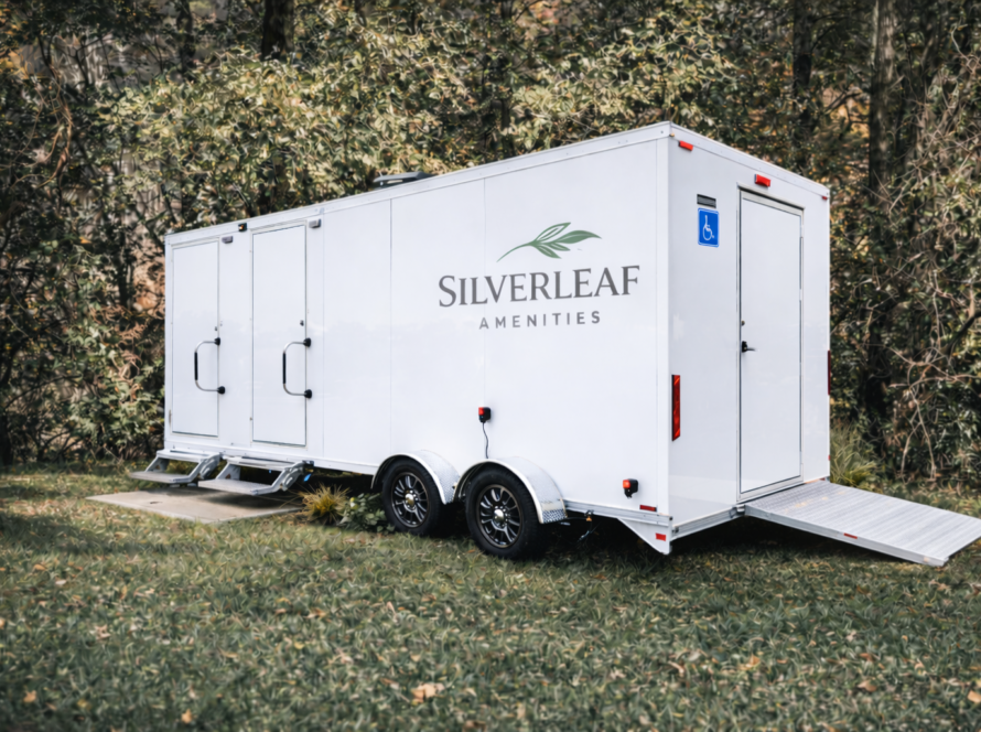 Accessible luxury restroom trailer with ramp by Silverleaf Amenity for outdoor events and venues.