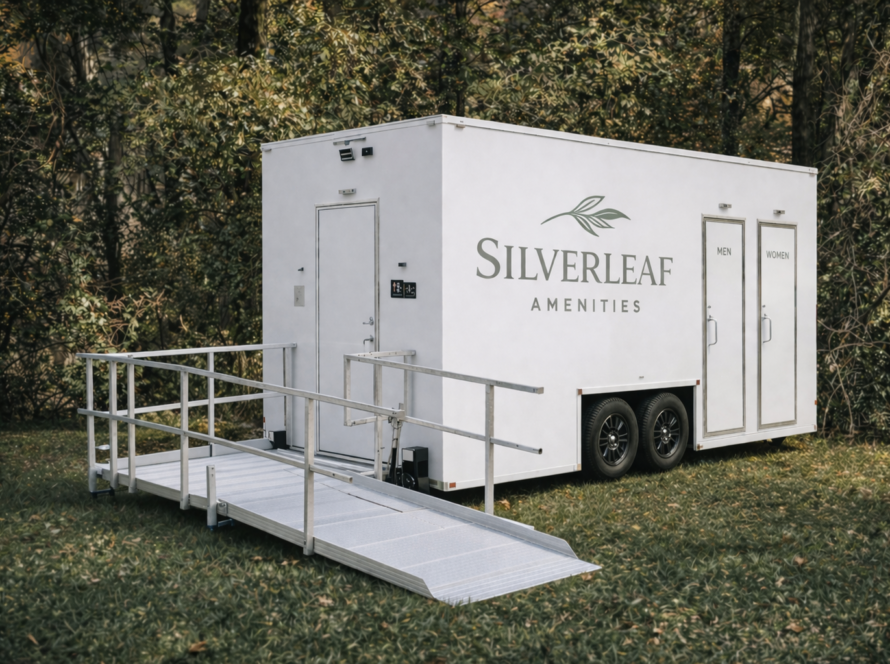 Accessible luxury restroom trailer with ramp by Silverleaf Amenity for outdoor events and venues.