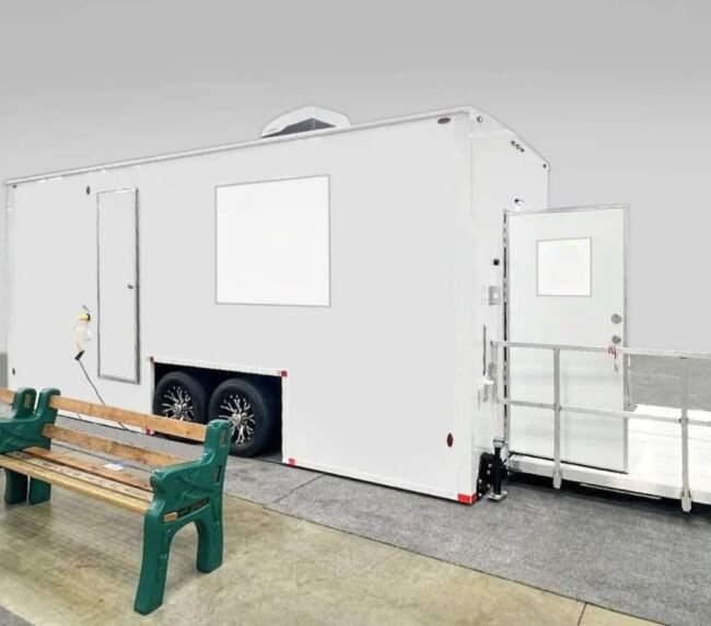 ADA-compliant restroom trailer with accessible ramp and exterior setup, ideal for event and construction rentals in Colorado