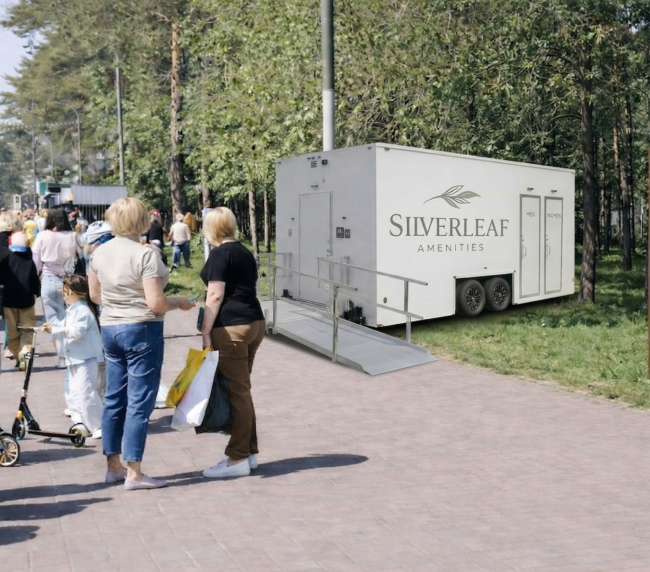 ADA restroom trailer with wheelchair ramp at outdoor event venue in Colorado by Silverleaf Amenities