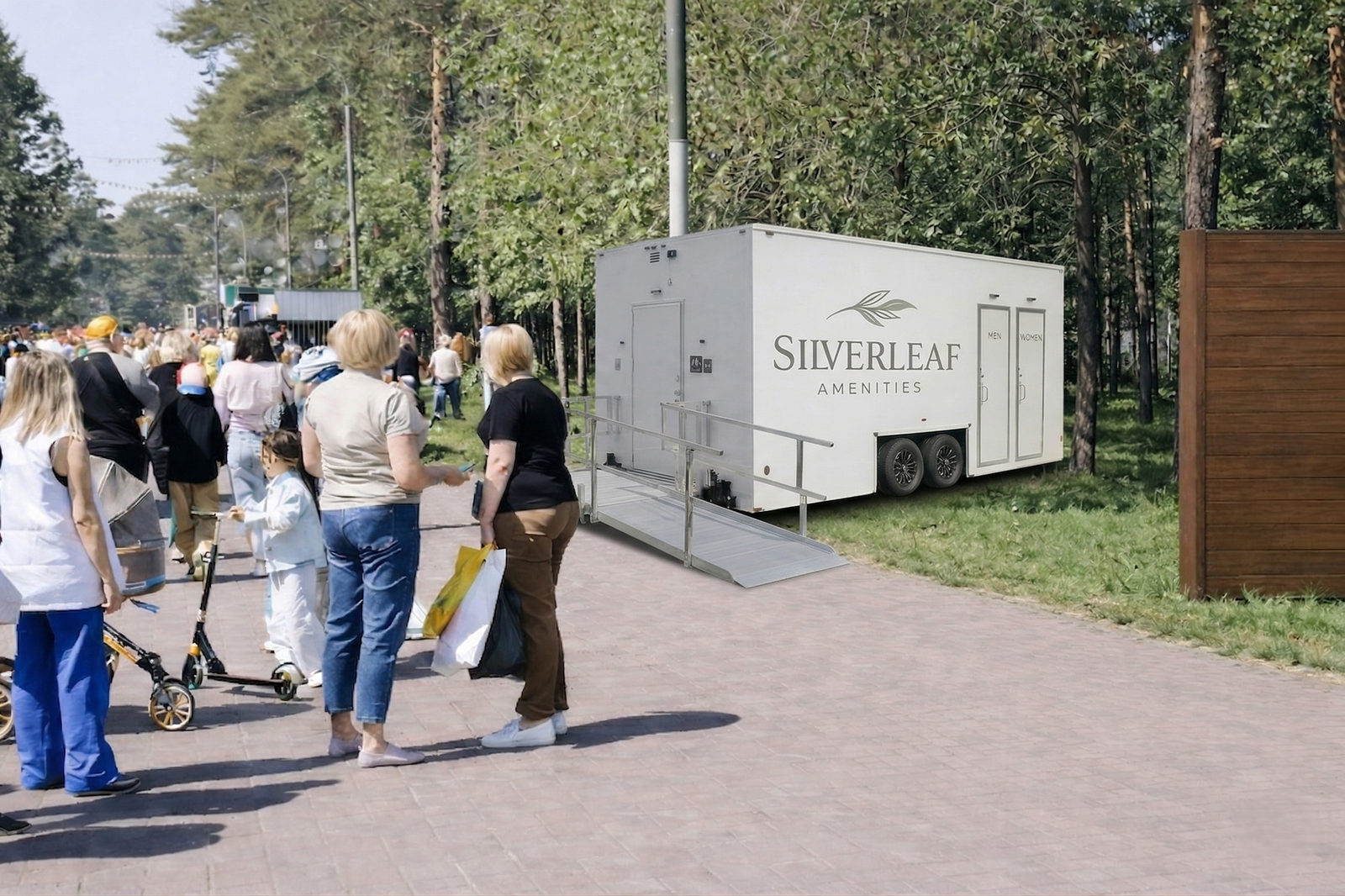 ADA restroom trailer with wheelchair ramp at outdoor event venue in Colorado by Silverleaf Amenities