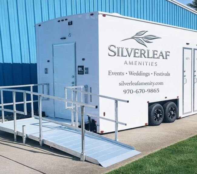 Accessible portable restroom trailer with wheelchair ramp by Silverleaf Amenities for events, weddings, and festivals