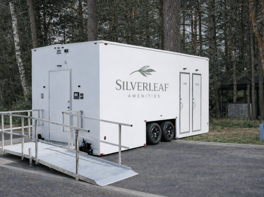 Luxury ADA-compliant restroom trailer with ramp by Silverleaf Amenities, available for events and job sites across Colorado